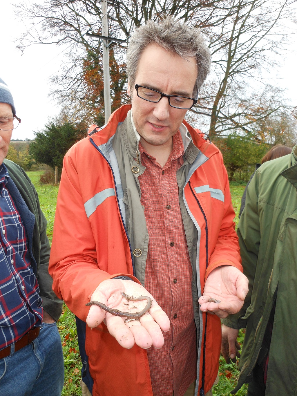 Dr David Jones (The British Museum) explaining speaking to farmers at a CSF event in Wiltshire how earth worms play a significant role in keeping soils healthy.