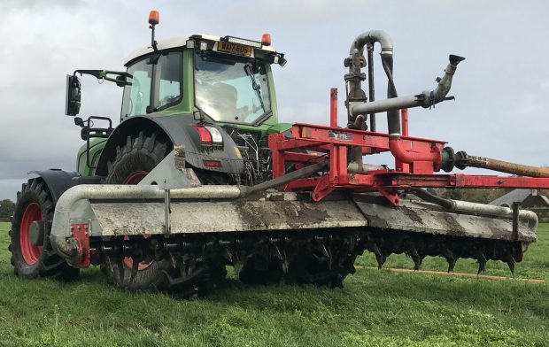 Image of a tractor dragging a plough