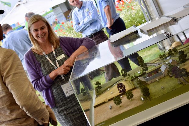 CSFO Bunty Wright standing next to a farm model at the Cereals Show 2018