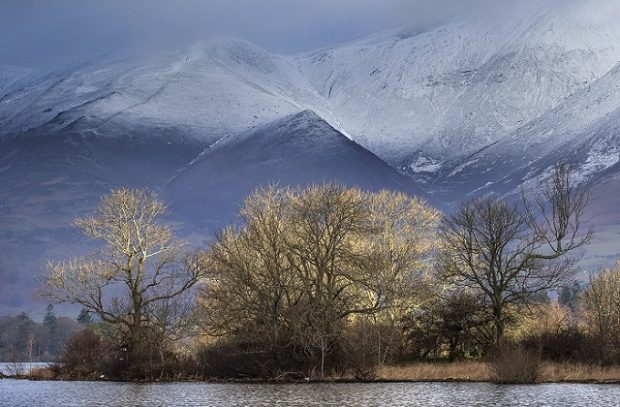 An image of Lake District National Park from across the lake