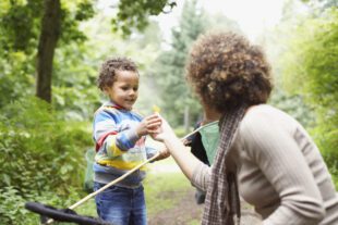 Mother and son exploring park