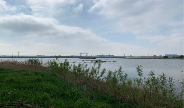A view across the River Tees with the Tees Transporter Bridge in the background.