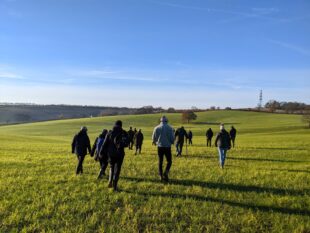 Farmers walking across a field at Woodborough Park Farm, Nottinghamshire, at the Arable Knowledge Hub event 
