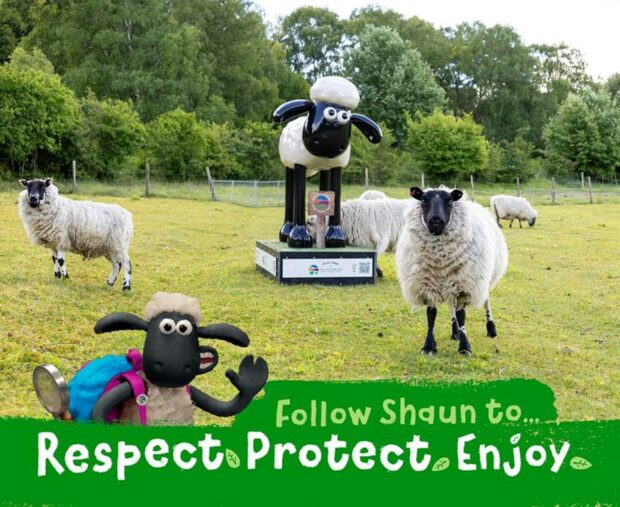 Image shows the Shaun statue stood amongst some of the reserve's sheep within a green grassy field, there are trees in the background. A Shaun the Sheep graphic is set over the image, which reads "follow Shaun to... Respect, Protect Enjoy" 