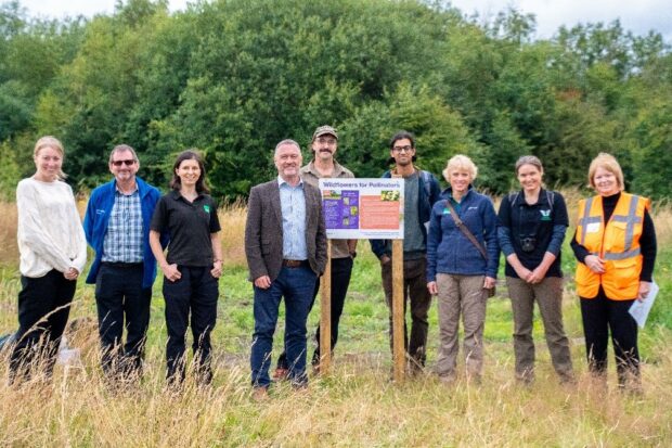 image shows secretary of state, Steve Reed with Purple Horizons' partners stood at the site 