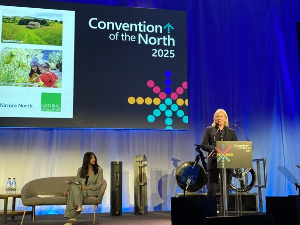 Marian Spain speaking at Convention of the North, with host Ranvir Singh