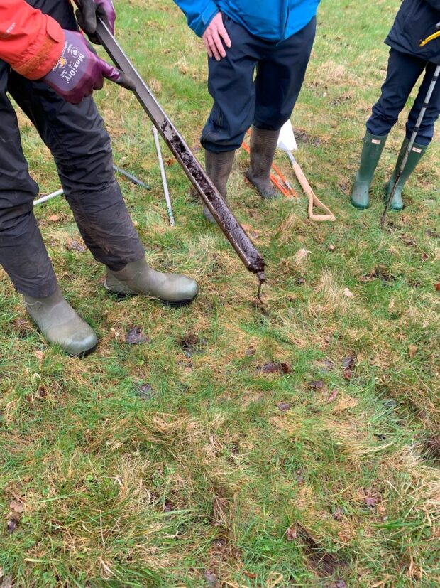 Principle 1 – check existing interest: Checking the peat layer at Bressingham Estate, Norfolk where the landowner was interested in a woodland creation scheme. Credit: Alisa Swanson