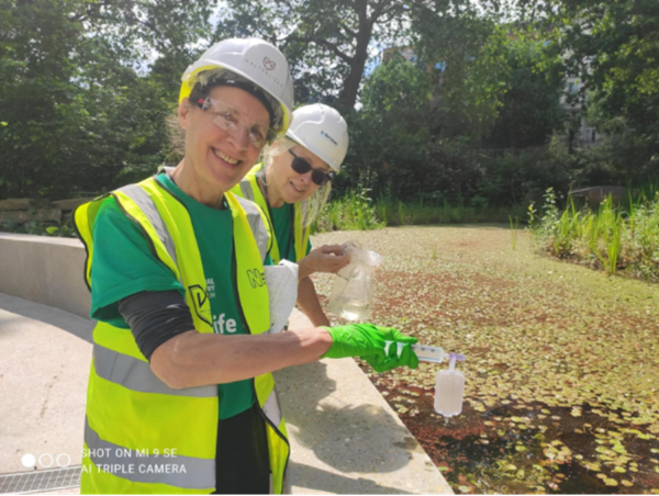 Two people collecting eDNA samples