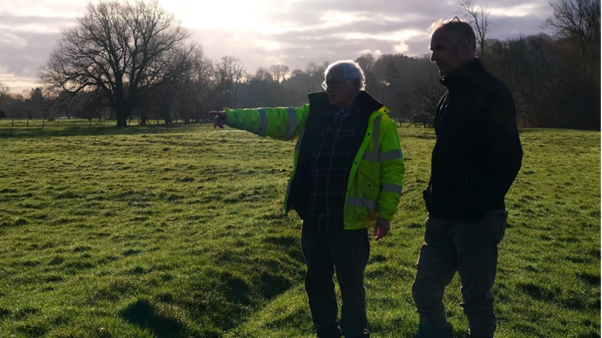 People chatting in water meadows