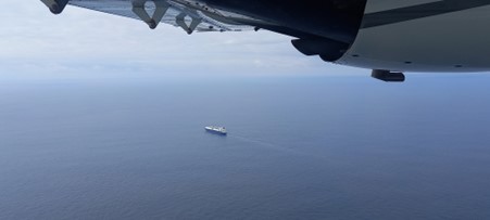 Aerial shot of a boat on the sea.