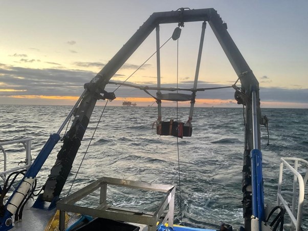 Grab sampling machinery on the boat out at sea.